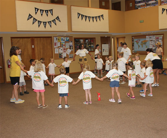 Children in a circle holding hands