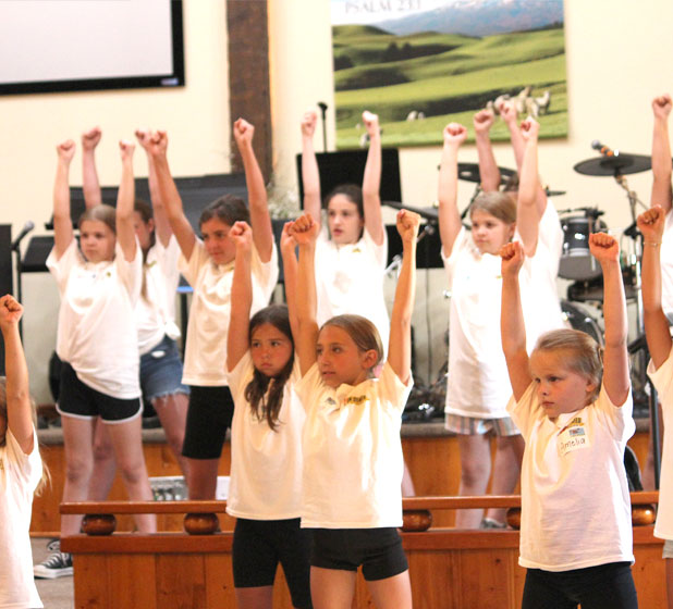 Girls learning to cheer