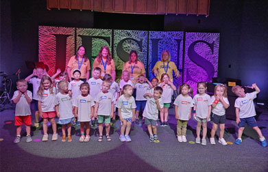 Group of children and staff in a church